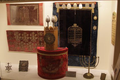 Torah scrolls, menoroth and other ritual objects of Jewish heritage displayed at the Jewish museum of Greece