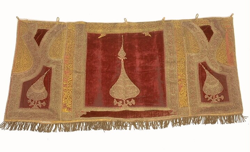 Ancient mantle with red and gold threads