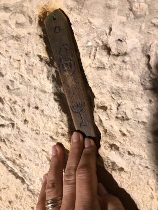 mezuzah in a wall besides a door of a former jewish house in Puglia