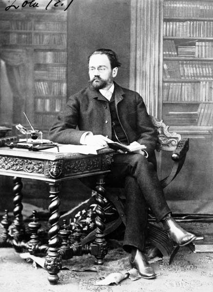 Photo of writer Zola at his desk